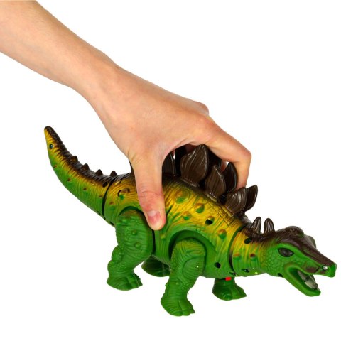 Dinozaur Stegozaur chodzi świeci ryczy