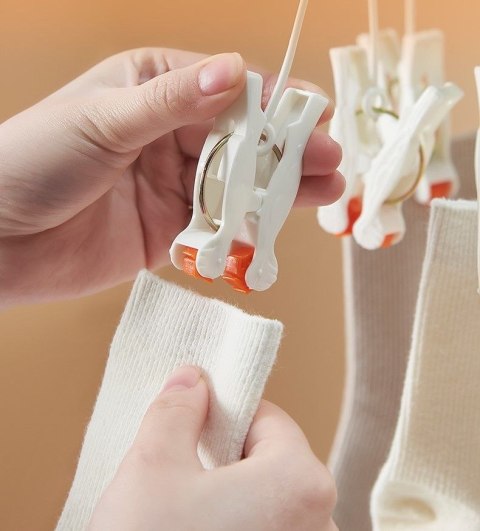 Plastikowy składany wieszak na ubrania z klipsami - 14 klipsów - zielony